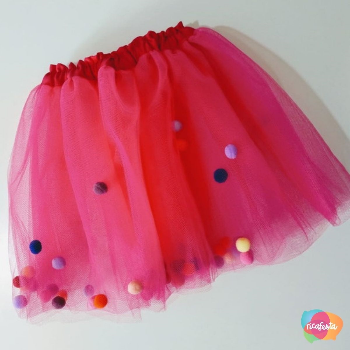 Saia de tutu com pompom top